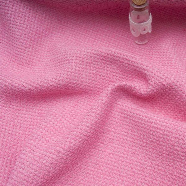 Tweed haut de gamme rose, texture bouclée